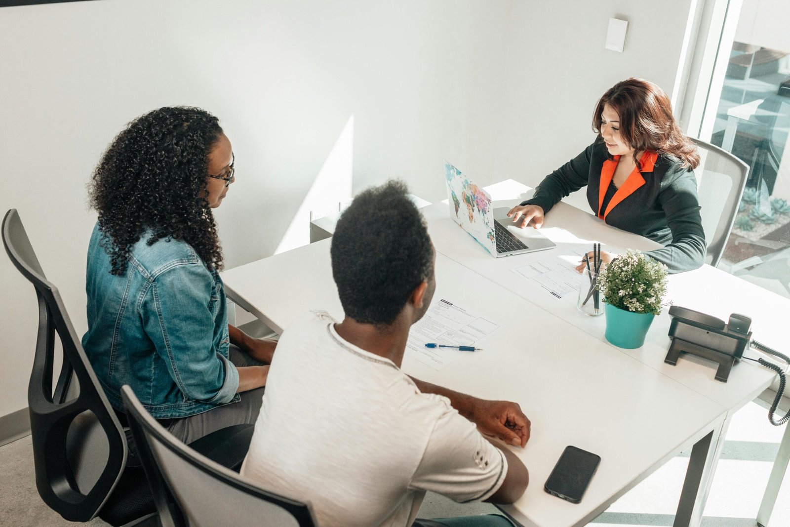 Solicitor discusses a medicolegal matter with clients at a table
